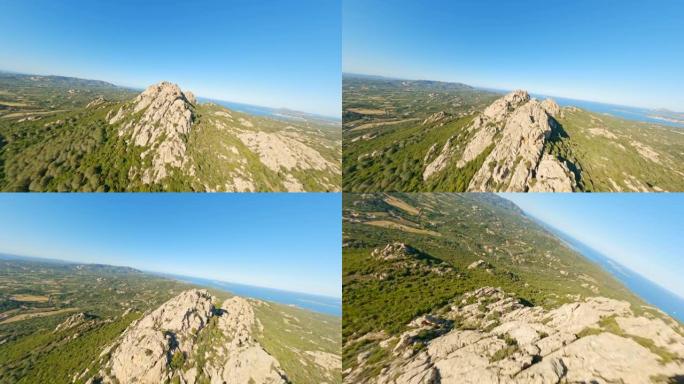 (山地冲浪) 从上方观看，FPV无人机在一些花岗岩山脉和圣潘塔莱奥村高速飞行时拍摄了令人惊叹的空中视