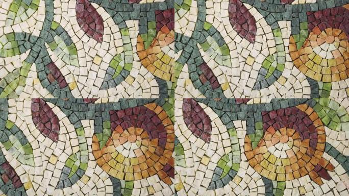 天然花岗岩石材制作的美丽马赛克图案。艺术工作室里彩色的小石砖马赛克。花卉图案是使用马赛克技术制作的。