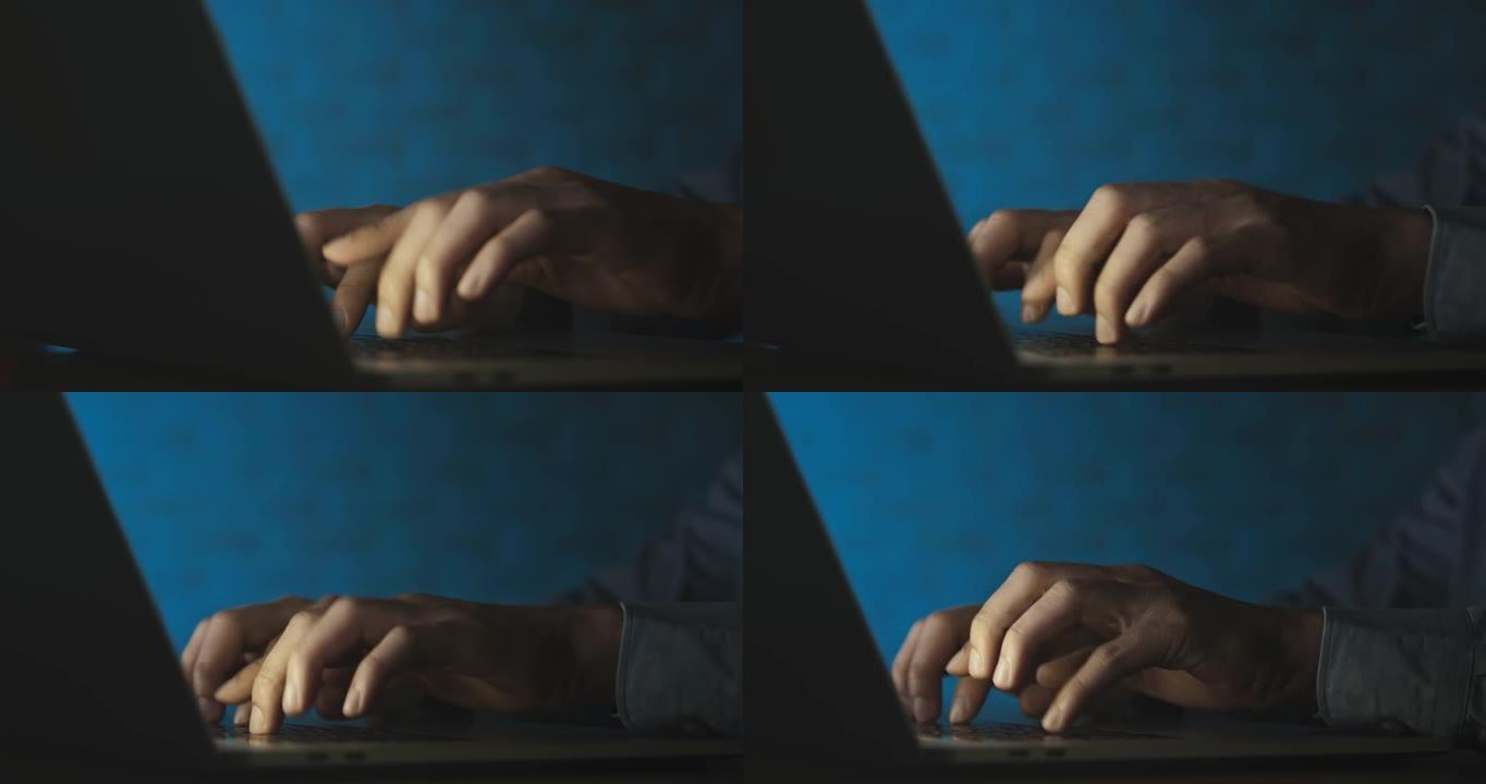 商人的手在夜间工作的笔记本电脑关键字上打字