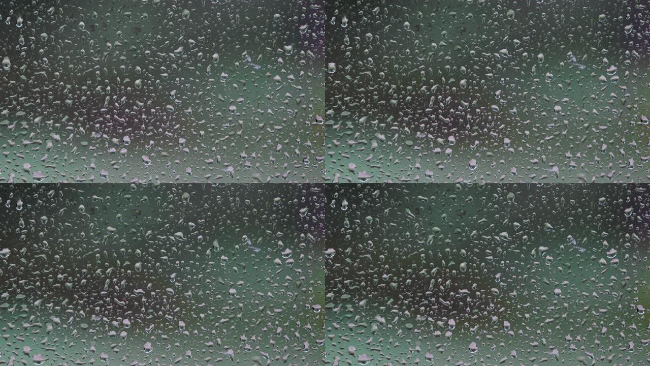 窗玻璃上的雨滴，暴雨天。