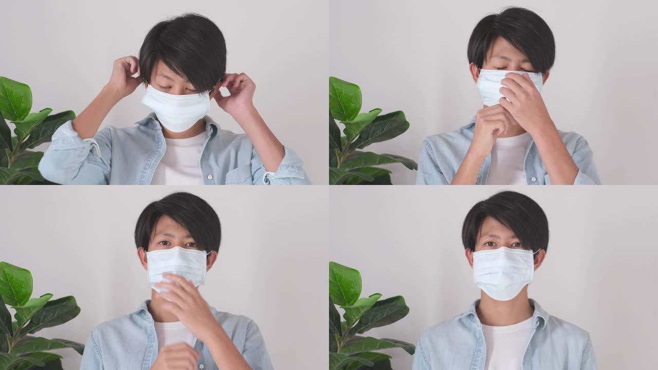 特写亚洲年轻人戴着防护口罩防止病毒，防止空气中感染，冠状病毒概念，4k分辨率