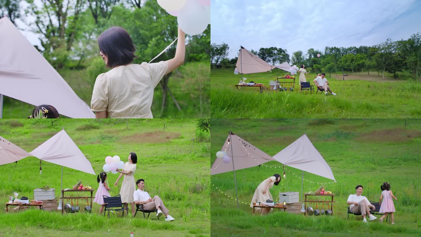 一家人在草坪露营玩耍