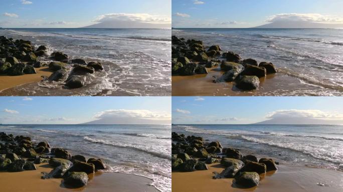 岩石海滩 -- 美国夏威夷毛伊岛西北海岸强烈海浪冲入和冲出岩石海岸的傍晚景色。