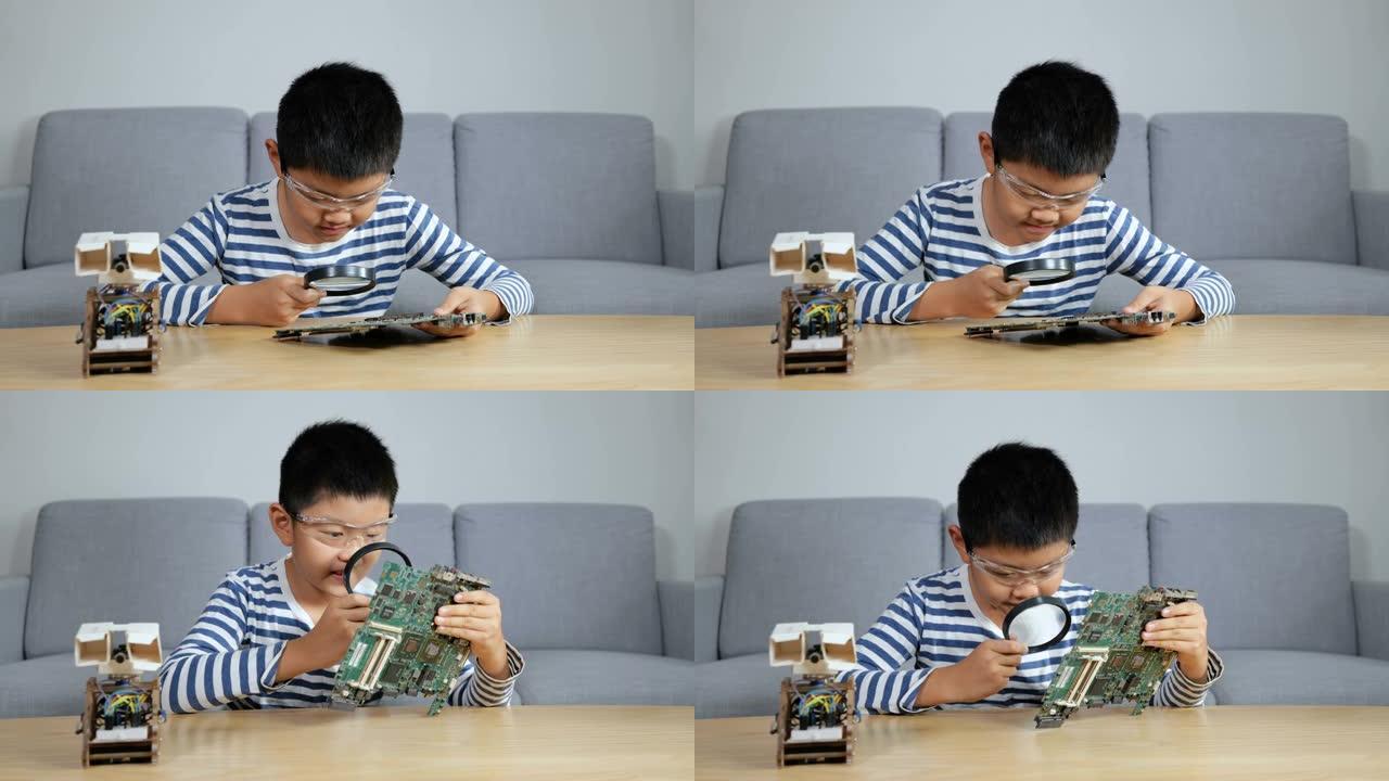 年轻的科学家正在用放大镜观察电路板