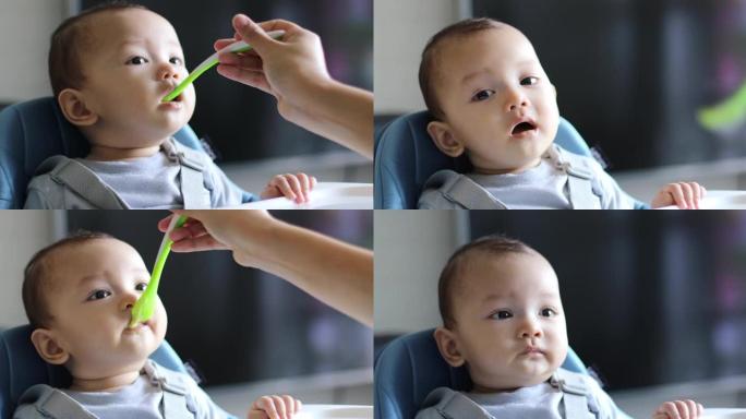 一个6个月大的婴儿正在吃饭
