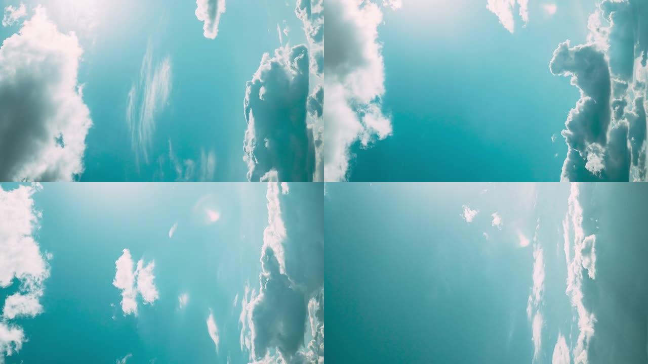 多云的蓝天下垂直拍摄雨云。自然背景4k延时。雨天气条件下的自然天空背景