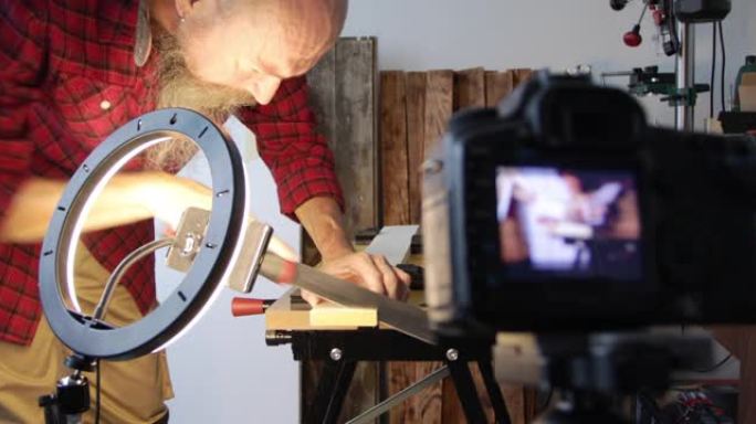 DIY木工伐木，男人用日本拉锯切割木板，拍摄