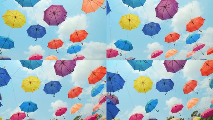 五颜六色的雨伞挂在天空