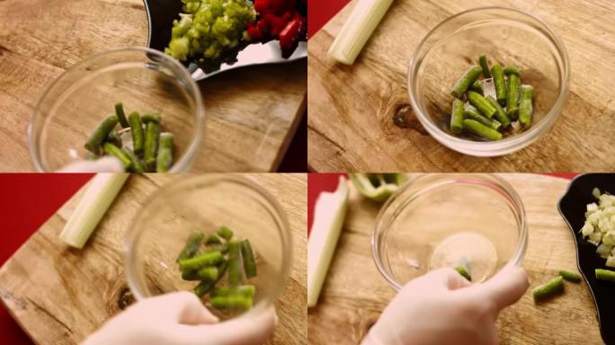 女人的手切皮亚托尼冷冻青豆特写。4k电影摄影视频