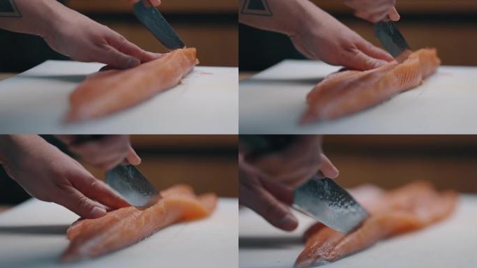 日本厨师切割并准备生鲑鱼以制作寿司