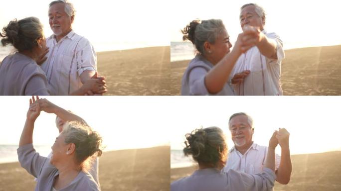 亚洲老年夫妇喜欢在夏日日落时在海滩上跳舞和浪漫的假期