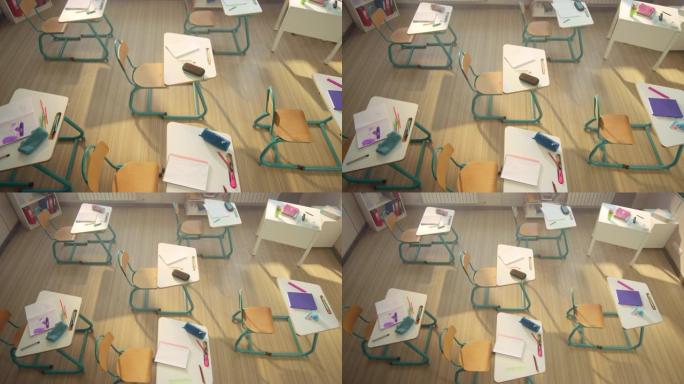 教室里的课桌椅。带学习用品的木制书桌