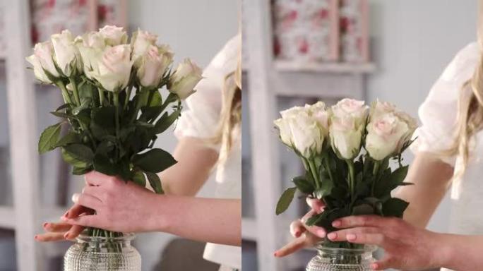 花店将新鲜的玫瑰放在花店的花瓶中