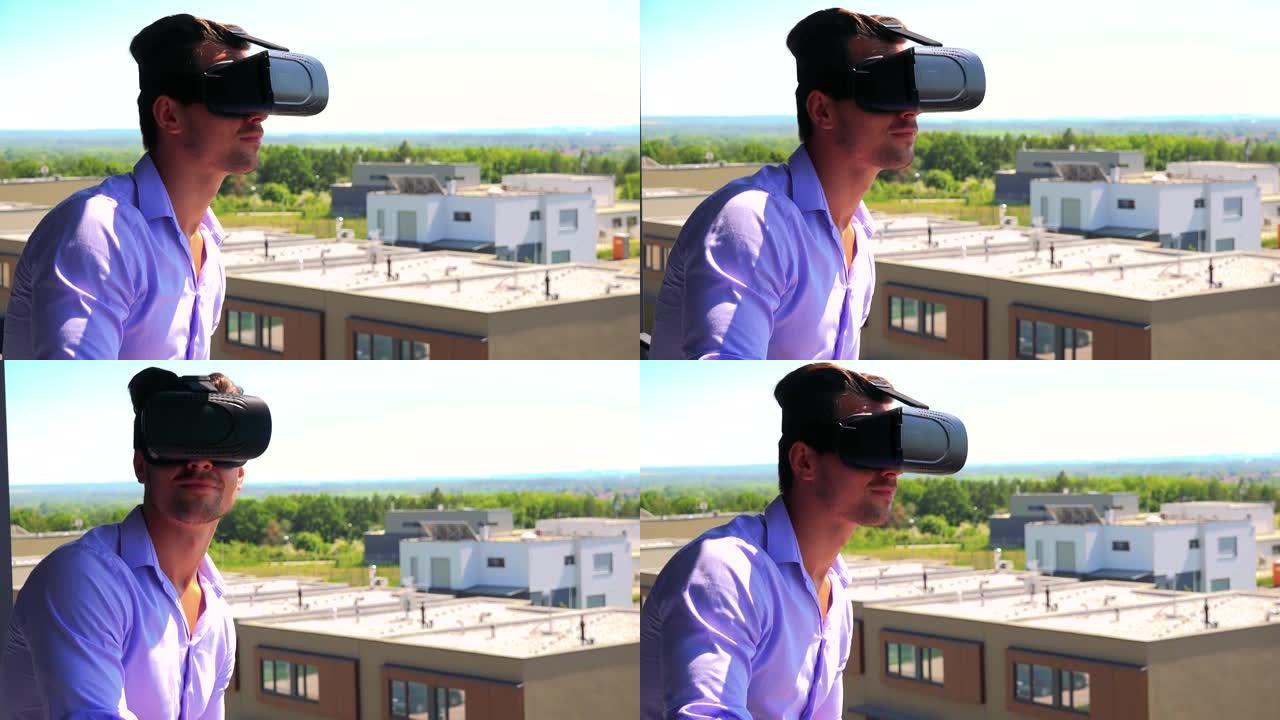 年轻帅哥在阳台上使用虚拟现实眼镜-背景中的建筑物和自然-特写