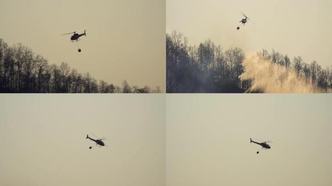 消防直升机向森林大火中滴水
