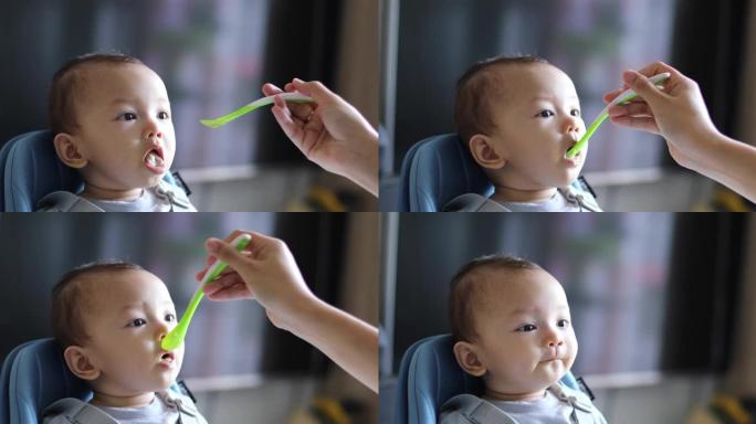 一个6个月大的婴儿正在吃饭