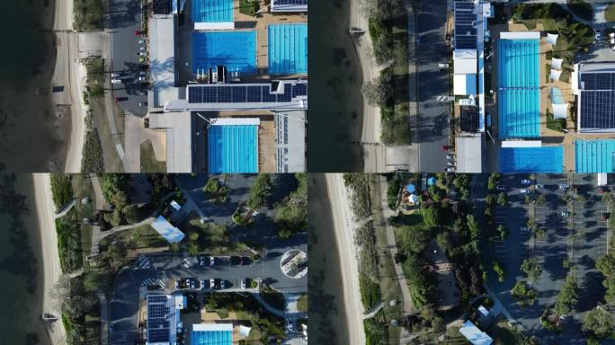 独特的景色俯视在沿海城市小径旁建造的奥林匹克游泳池综合体。高无人机视图