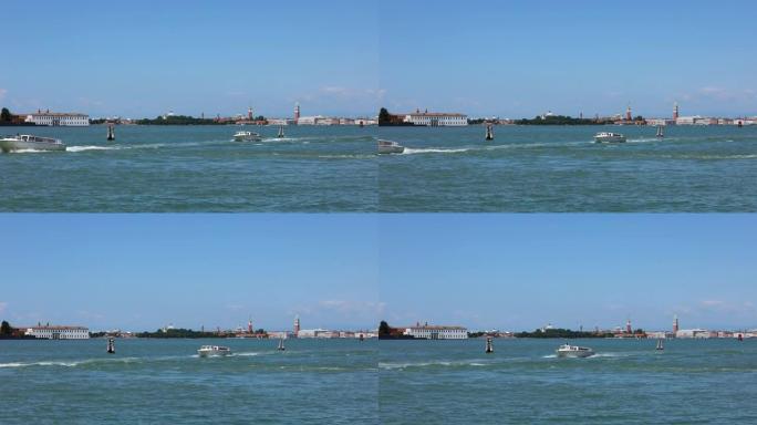 背景中的威尼斯运河，圣马可钟楼和杜卡莱宫中的许多船