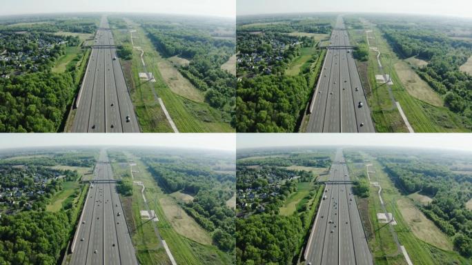 空中无人机拍摄日落时的公路交通，城市交通和空气污染
