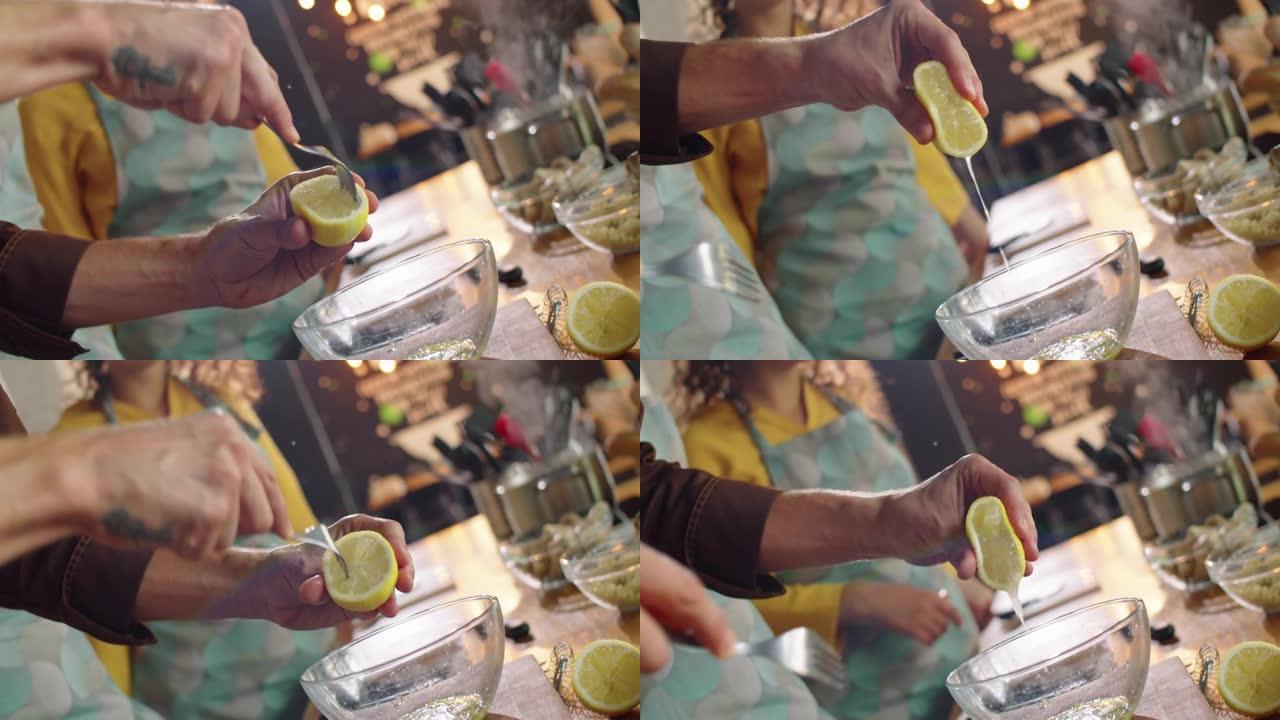 男厨师挤柠檬汁的手