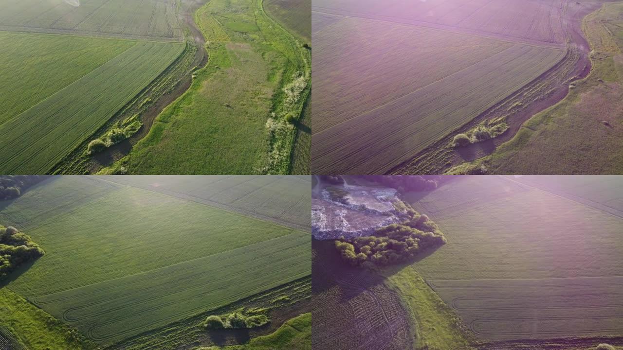 农村田野间大垃圾堆的航拍。飞越垃圾车，在户外空旷的地方倾倒垃圾。全球环境污染问题。顶视图。