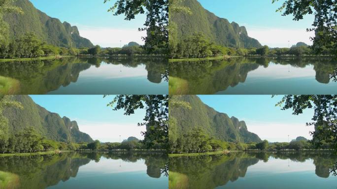 绿树成荫，青山碧水，自然池塘幽静。