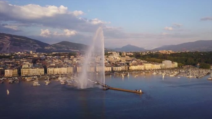 瑞士日落之光日内瓦城市景观湖著名喷泉湾空中全景4k