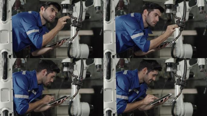 男工程师在工业机械组件中组装后检查机器的准备情况。
