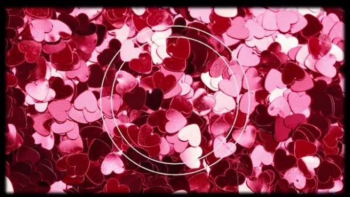 红色和粉红色心脏上的白色圆圈和滑动胶片框架的动画