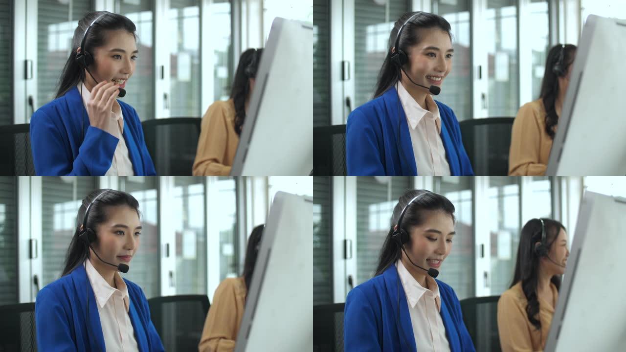 美丽的女性呼叫中心代理在工作站上与客户交谈时的肖像