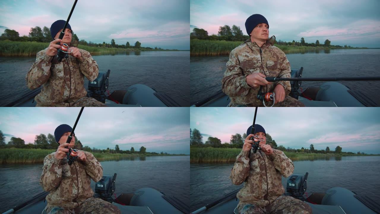 男子从船上钓鱼。年轻的业余垂钓者在日落时从船上钓鱼