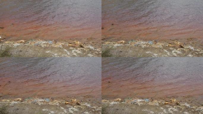 海岸慢动作视频中有很多垃圾的酸性矿山排水池