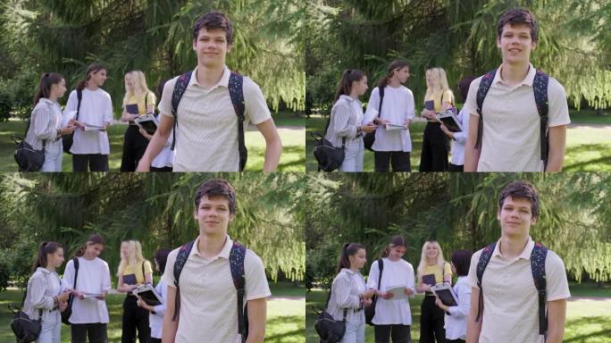 男生16岁，17岁，背着背包，在学校公园