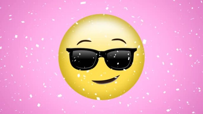 粉红色背景上的白色五彩纸屑掉落在太阳镜中快乐，酷的表情符号上的动画