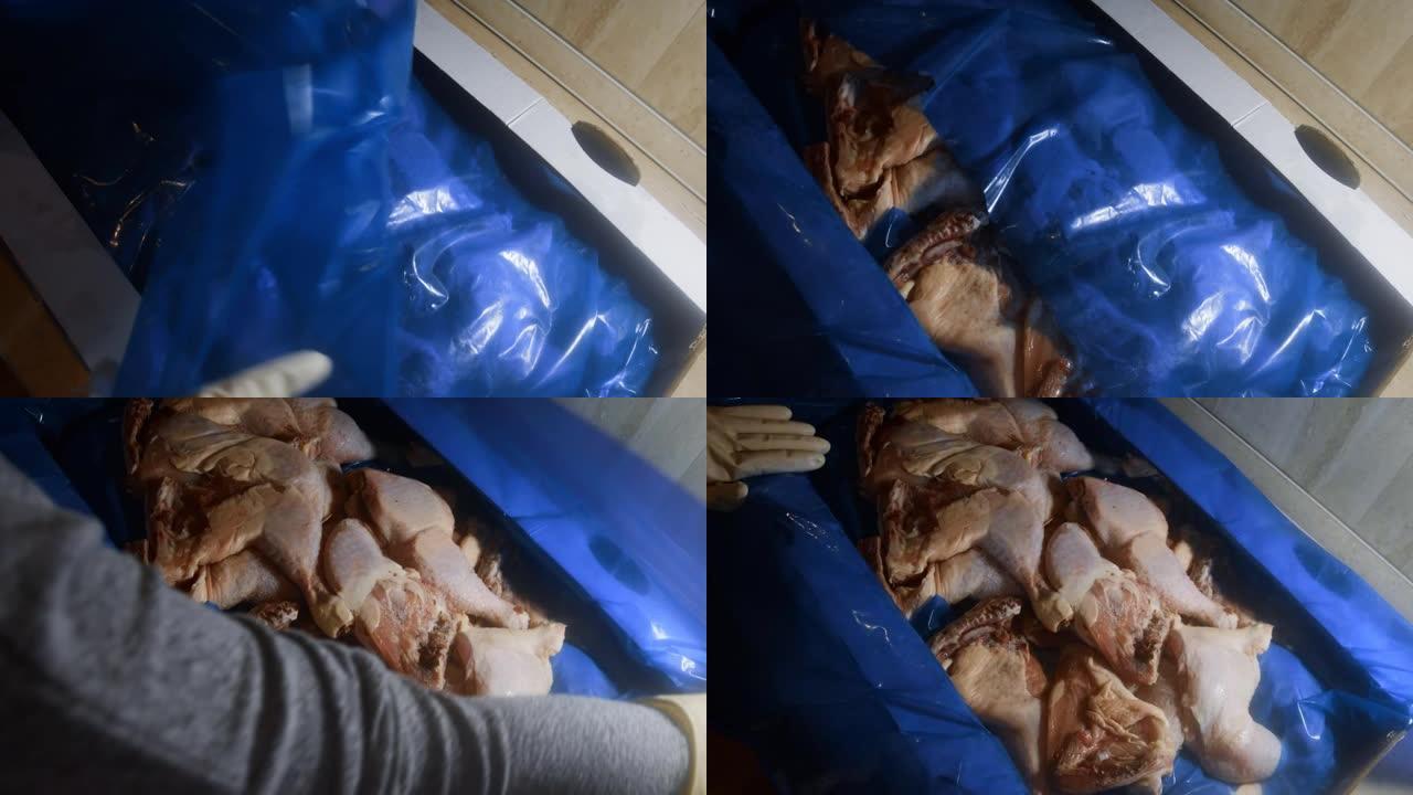 双手戴着手套打开装满冷冻鸡腿的盒子的俯视图。用冰覆盖的冷冻生鸡肉。4k视频