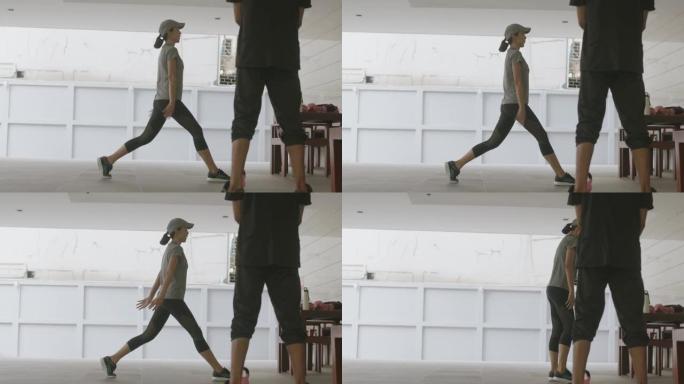 积极运动的女人用一条腿站起来锻炼大腿肌肉-股票视频