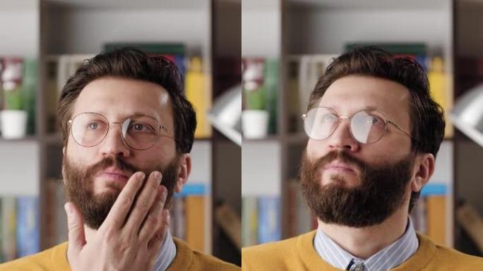 人思考，集思广益，好主意。办公室或公寓房间里戴着眼镜的大胡子男人的垂直视频，沉思的脸环顾四周，思考和