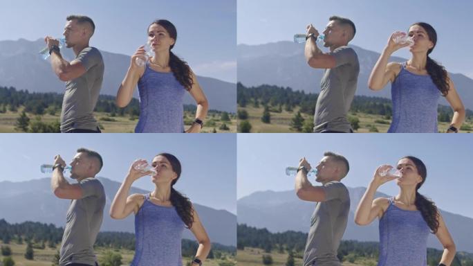 慢动作拍摄了几个慢跑者喝水，在大自然中进行了激烈的训练后休息。