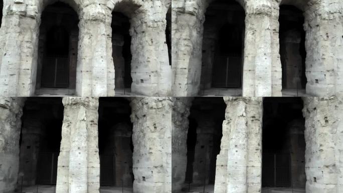 举世闻名的罗马斗兽场巨大拱门上的移动视图。罗马帝国时期建造的迷人的四层圆形剧场
