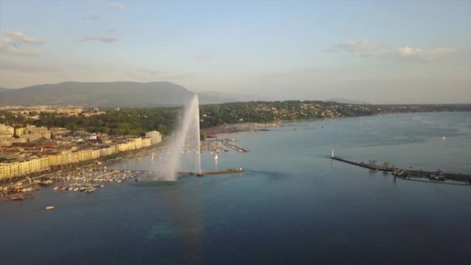 瑞士日落之光日内瓦城市景观湖边喷泉湾空中全景4k