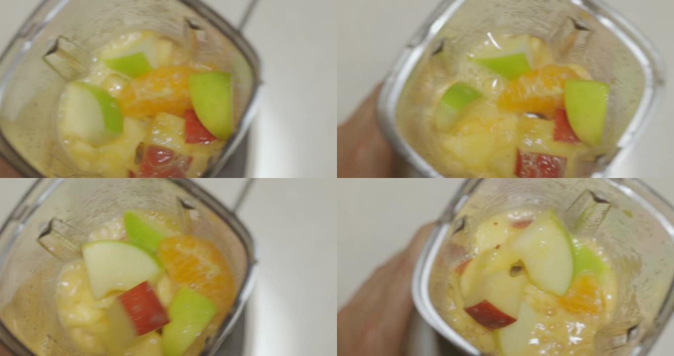 SLO MO混合水果冰沙在罐子里混合。