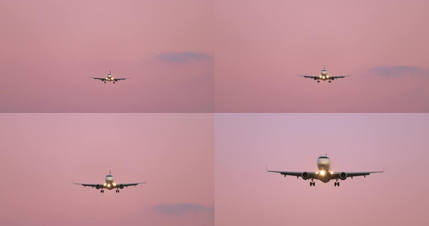 粉色日落天空背景4K上的电影慢动作前视白色飞机
