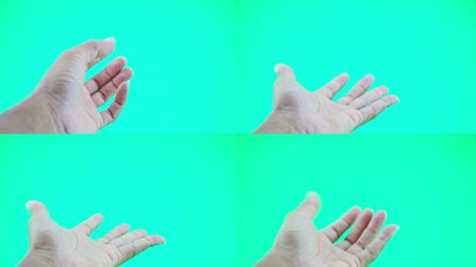 打开你的手的特写侧视图男人的手在绿屏背景上孤立的手男人拿着空打开的平手掌显示一些虚拟和不可见的东西