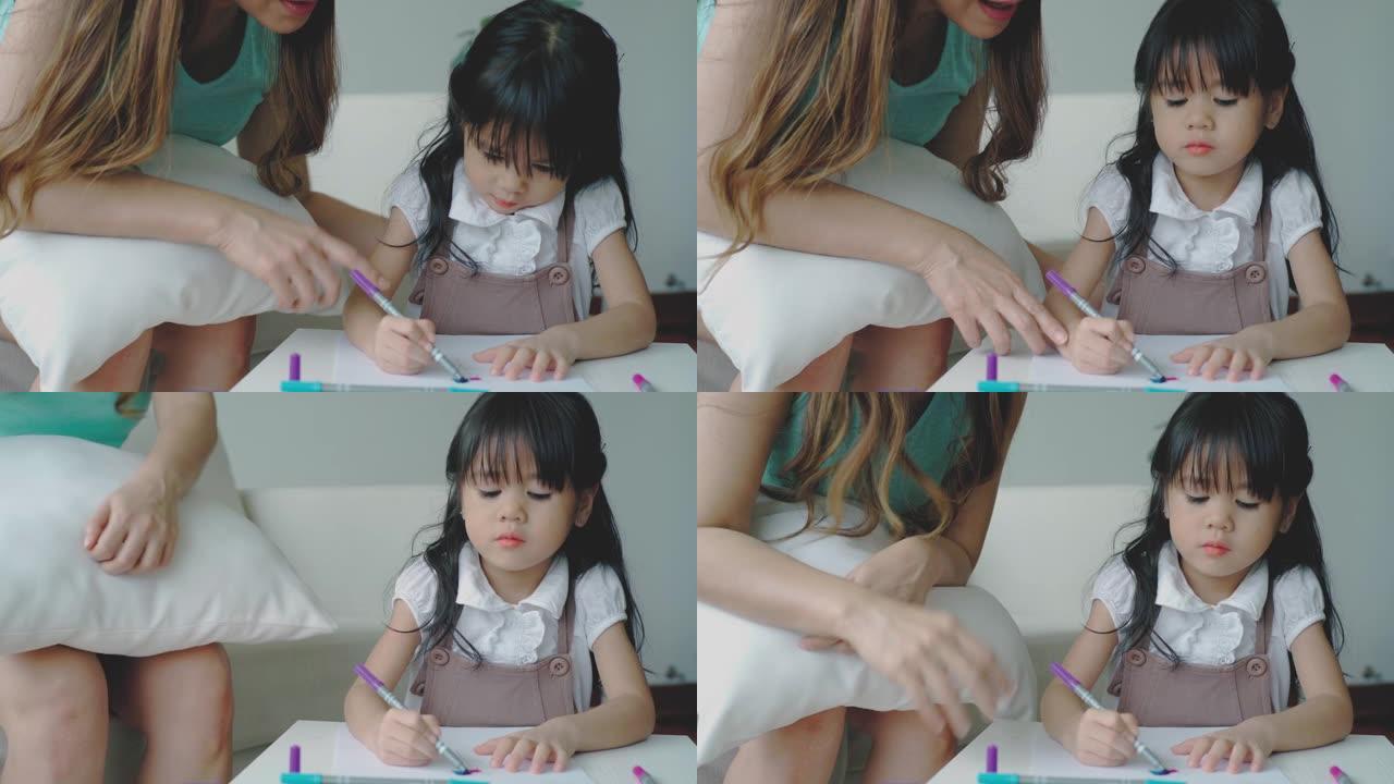 一位亚洲母亲在家教女儿