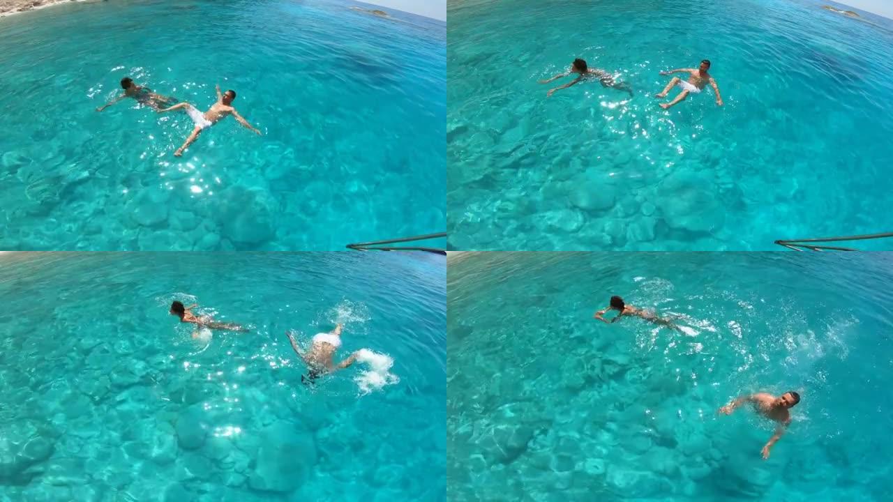 在希腊扎金索斯享受暑假和在海里游泳的情侣的4k视频