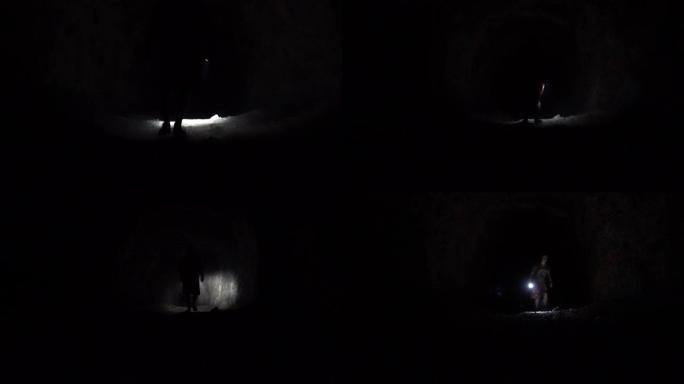 一个在黑暗的洞穴里拿着灯笼的人