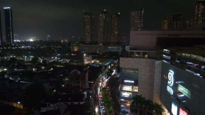 夜间照明雅加达市市中心交通街著名购物中心屋顶全景4k印度尼西亚