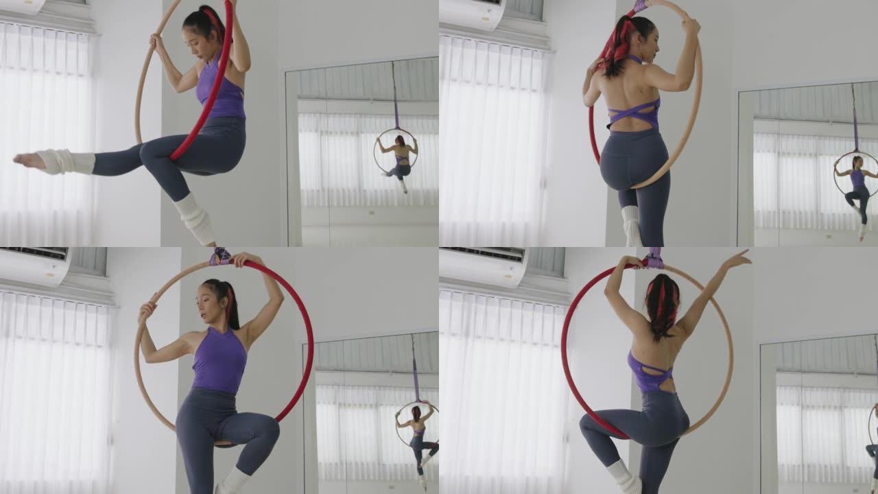 泰国主动运动女子在攀登和旋转前用腿钩住空中箍-股票视频