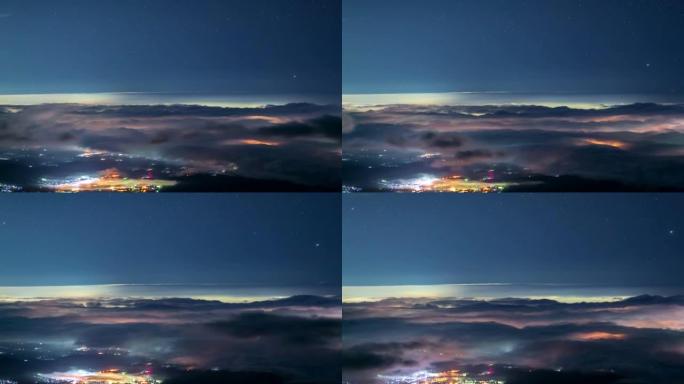 从富士山入口处的云海和星空。富士Subashiri到城镇的延时