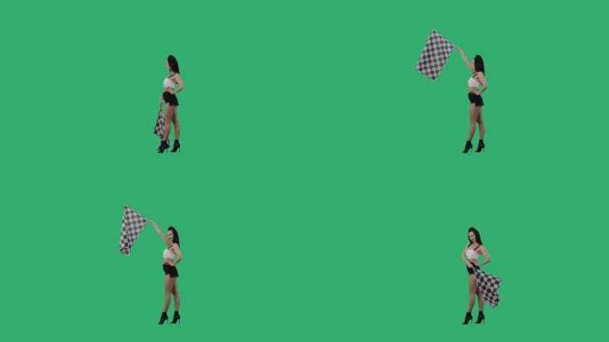 黑发挥舞着黑白方格赛车旗的侧视图，标志着比赛开始。年轻女子在绿屏背景下摆出全长姿势。慢动作就绪，4k